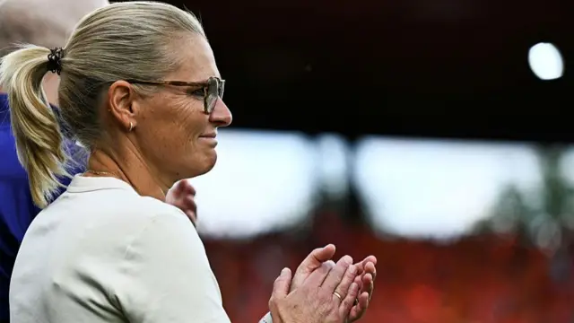 England's Dutch coach Sarina Wiegman claps