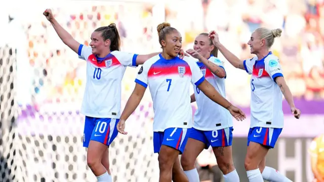 Lauren James of England celebrates with teammates after scoring her team's third goal