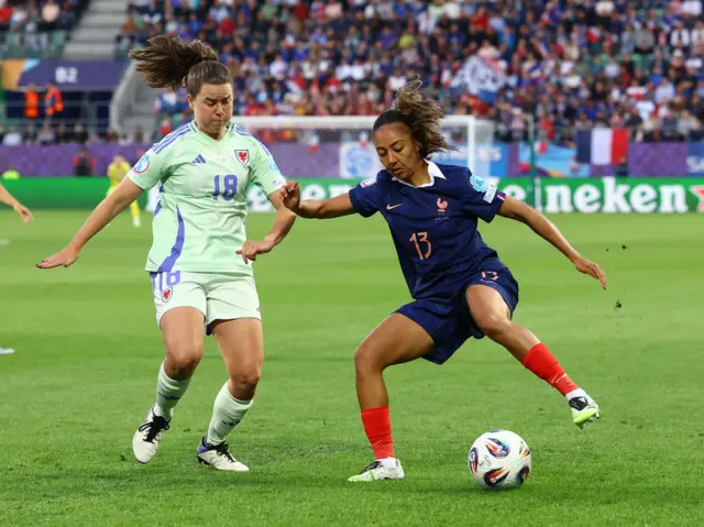 Wales' Esther Morgan in action with France's Selma Bacha