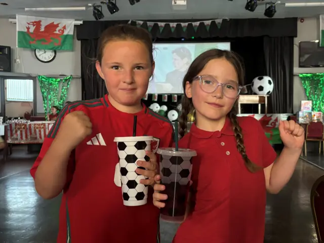 Ellie & Indigo both 9 are backing Wales to win whilst watching the match at Sarn Social Club near Bridgend.