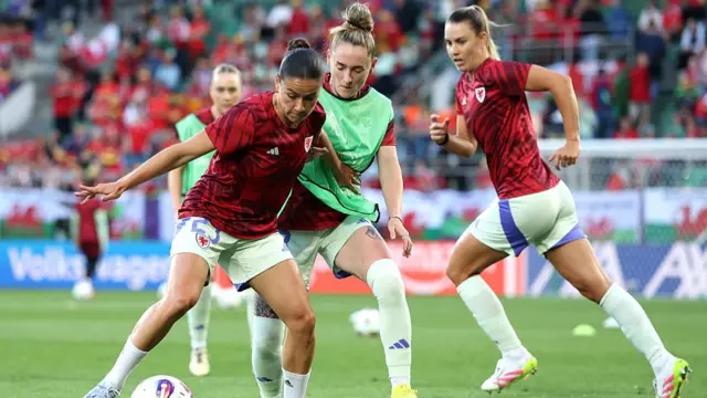 Ffion Morgan and Rachel Rowe of Wales warm up