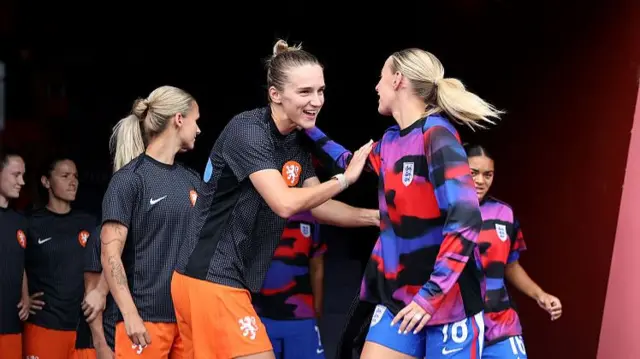 Vivianne Miedema of Netherlands and Chloe Kelly of England interact prior to the warm up