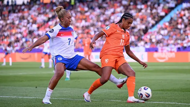 Esmee Brugts of the Netherlands is challenged by Lauren James of England