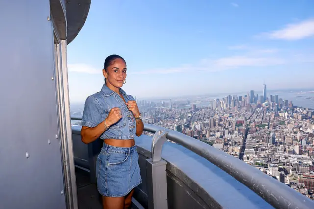Amanda Serrano smiling at the top of the Empire State Building