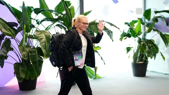 Sarina Wiegman, Head Coach of England, waves as she arrives at the stadium