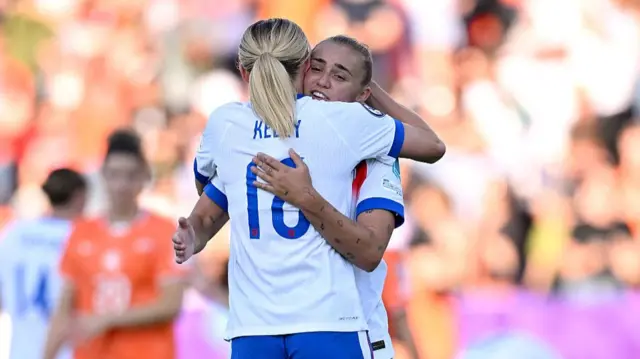 Chloe Kelly and Georgia Stanway of England interact following victory