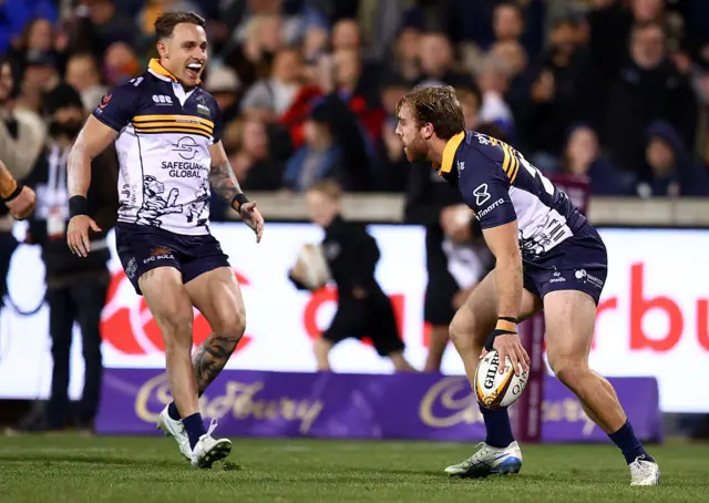 Hudson Creighton scoring a try