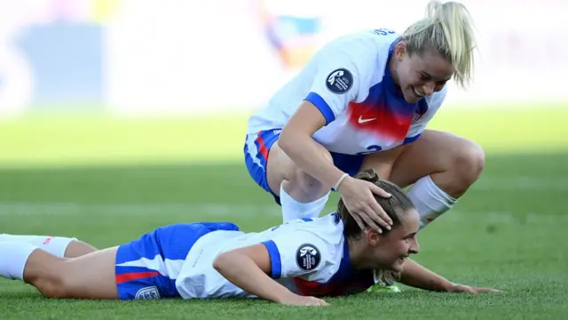 Ella Toone of England is congratulated by teammate Alessia Russo after scoring her team's fourth goal