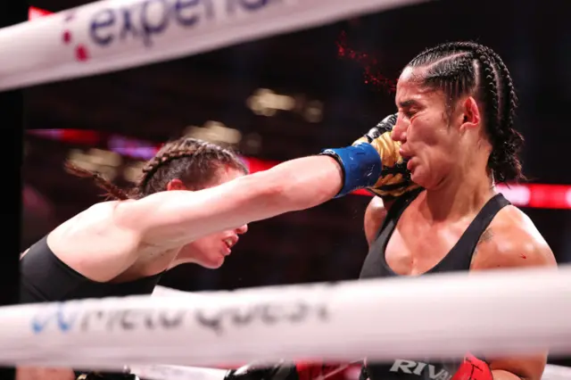 Katie Taylor landing a straight right on Amanda Serrano