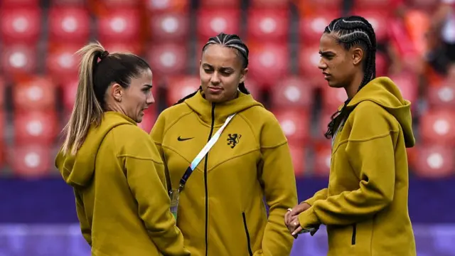 Netherlands' midfielder #10 Danielle van de Donk, Netherlands' forward #12 Chasity Grant and Netherlands' forward #11 Esmee Brugts chat prior to the start of the UEFA Women's Euro 2025 Group D football match between England and The Netherlands at the Letzigrund Stadium