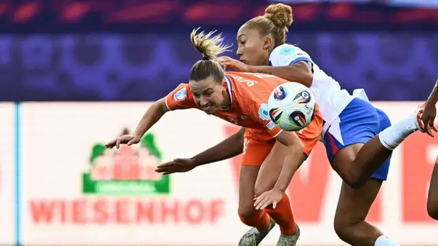 Netherlands' midfielder #14 Jackie Groenen and England's forward #07 Lauren James fight for the ball
