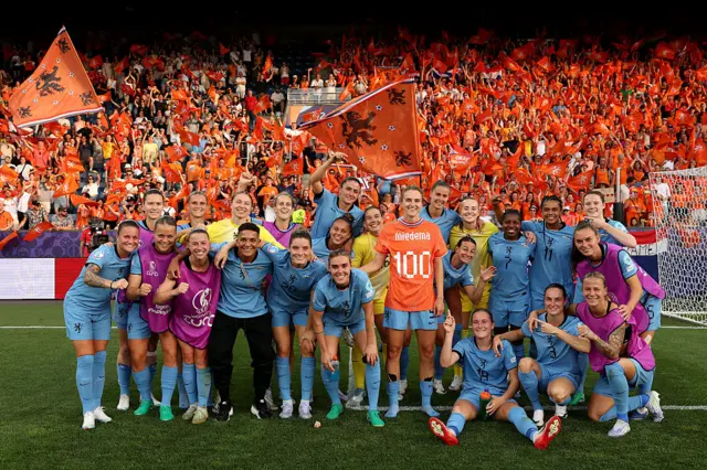 Vivianne Miedema of the Netherlands poses for a photo with her teammates, while wearing a t-shirt which marks her 100th goal for the Netherlands, after the teams victory in the UEFA Women's EURO 2025 Group D match between Wales and Netherlands at Luzern Arena on July 05, 2025 in Lucerne, Switzerland.