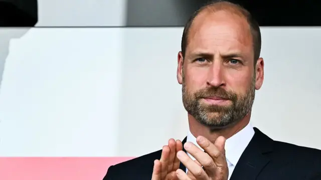 Britain's Prince Willam, Duke of Cambridge, claps