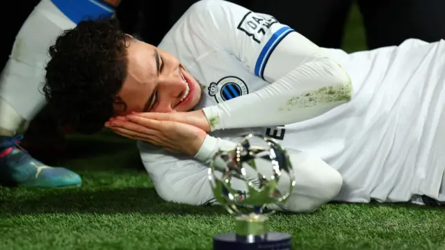 Chemsdine Talbi of Club Brugge KV celebrates victory following the UEFA Champions League 2024/25 League Knockout Play-off second leg match between Atalanta BC and Club Brugge KV at Gewiss Stadium