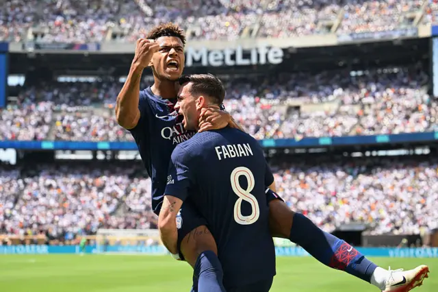 Fabian Ruiz celebrates with Desire Doue after scoring the first goal for PSG