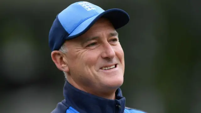 A close-up of Graham Thorpe smiling with an England cap on.