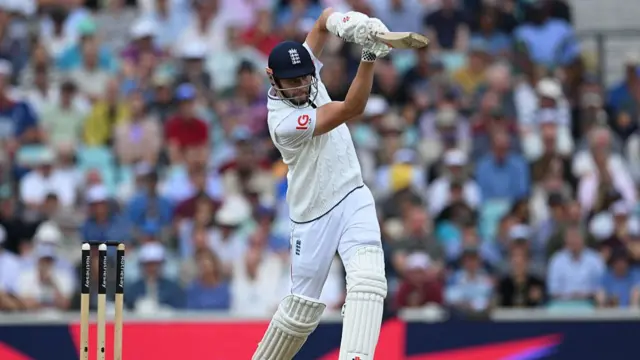 Gus Atkinson drives for four vs India at the Oval.