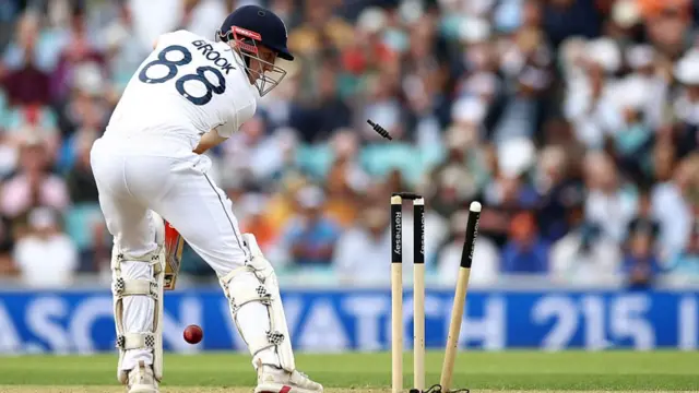 Harry Brook looks back at his stumps after being bowled by Mohammed Siraj.