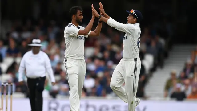 Jaiswal and Krishna celebrate taking the wicket of Jamie Smith.