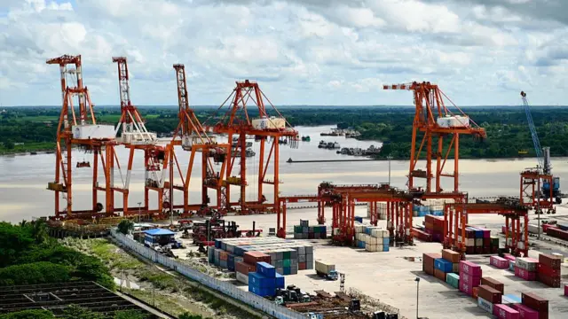 A general view shows cranes and containers at the Myanmar Industrial Port along the Yangon River in Yangon