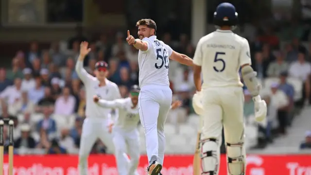 Josh Tongue points in celebration after getting a wicket vs India.