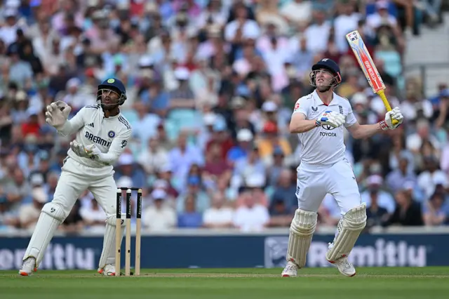 Harry Brook of England mistimes a shot as wicketkeeper Dhruv Jurel of India looks on during Day Two of the 5th Rothesay Test Match between England and India at The Kia Oval on August 01, 2025 in London, England.