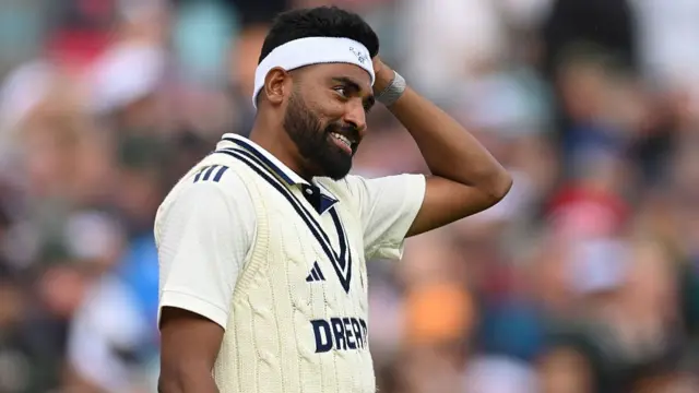 Mohammed Siraj smiles at The Oval, wearing a Graham Thorpe tribute headband.