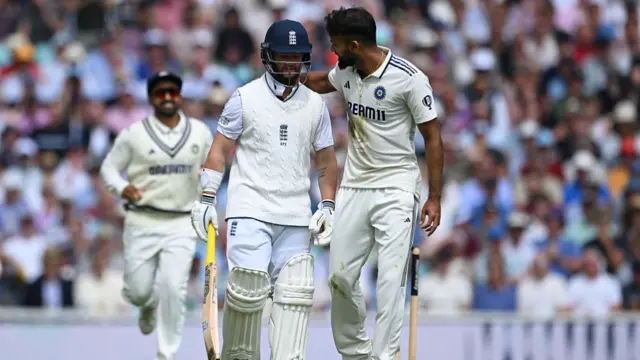 Akash Deep puts his arm around Ben Duckett after dismissing him.
