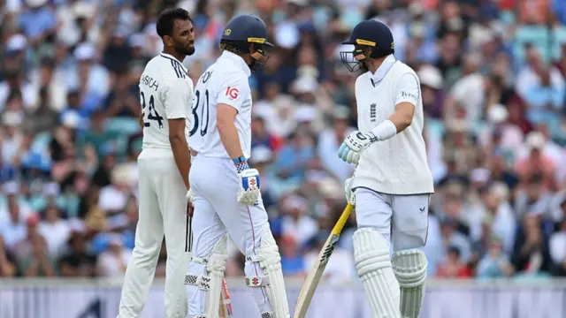 Krishna with Joe Root exchanging words.