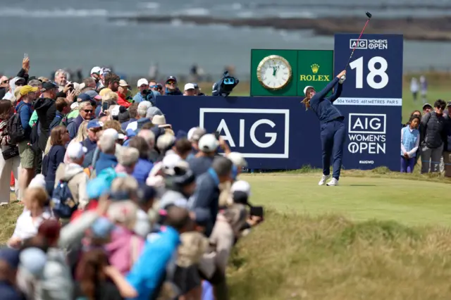 Lottie Woad tees off on 18th