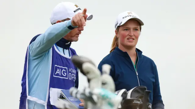 Lottie Woad with her caddie