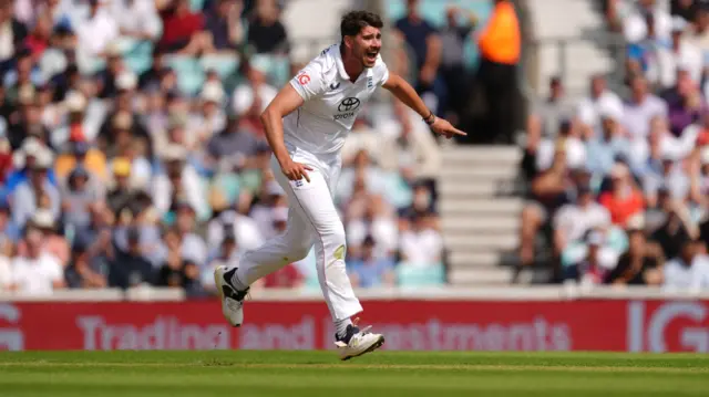 Josh Tongue celebrates taking a wicket against India