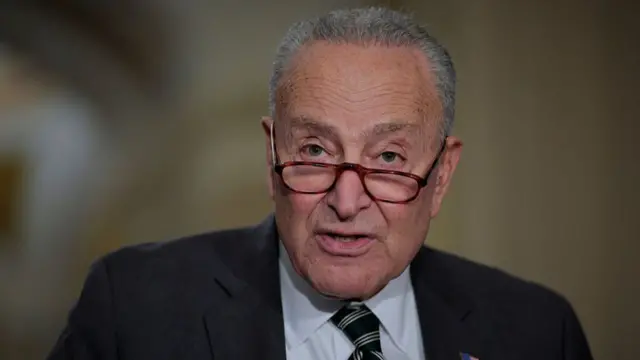 Chuck Schumer in a black suit
