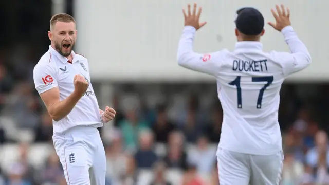 Gus Atkinson celebrates taking a wicket by pumping his fist vs India.