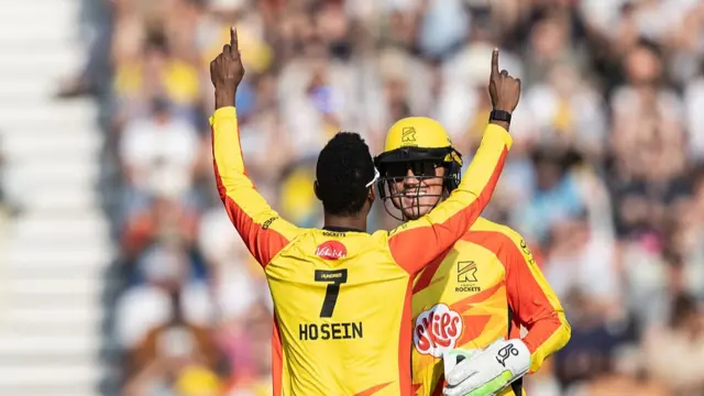 Akeal Hosein of Trent Rockets celebrates with his team mates after taking the wicket of Dawid Malan of Northern Superchargers