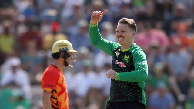 Michael Bracewell of Southern Brave celebrates with team mate James Vince after taking the wicket of Jacob Bethell
