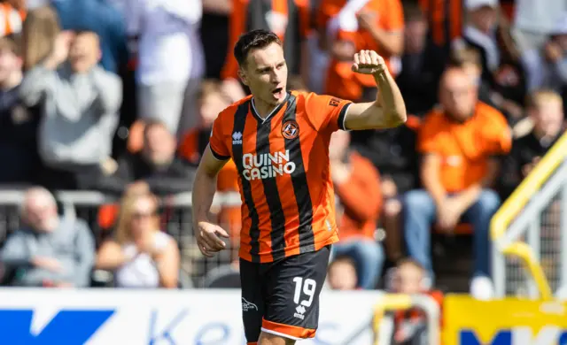 Hearts' Lawrence Shankland celebrates after scoring from the penalty spot to make it 1-0 during a William Hill Premiership match between Dundee United and Heart of Midlothian at the CalForth Construction Arena at Tannadice Park