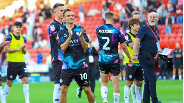 Scott Twine, centre, and Bristol City players applaud fans after beating Sheffield United 4-1 at Bramall Lane