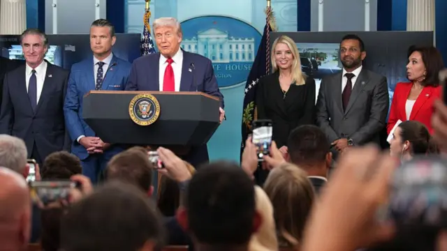 Donald Trump at podium in White House briefing room