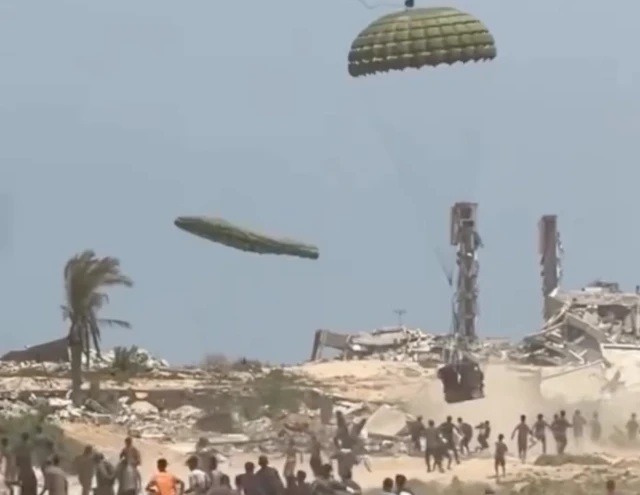 A screengrab from the video shows the moment the aid was dropped on Gaza
