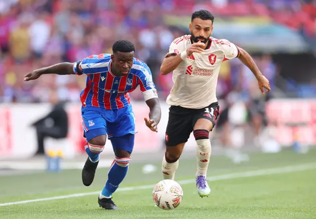 Mohamed Salah of Liverpool in action with Marc Guehi of Crystal Palace