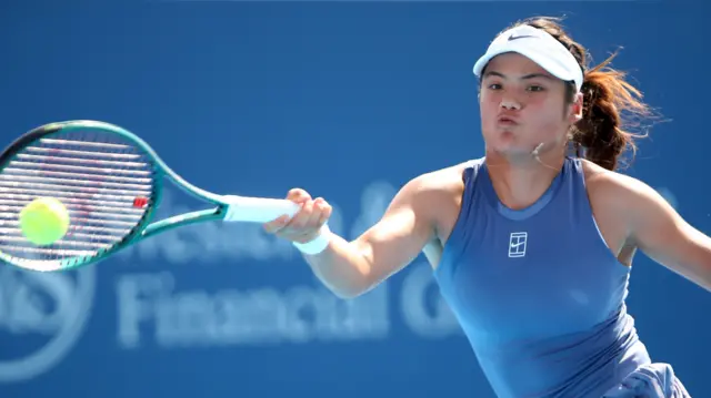 Emma Raducanu hits a forehand