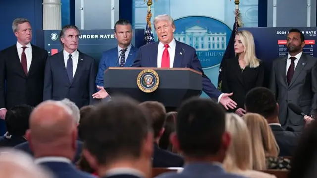 Trump stands before press at briefing