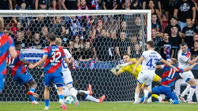 Viktoria Plzen's Rafiu Durosinmi (L) scores to make it 1-0 during a UEFA Champions League Third Round Qualifier, Second Leg, between Viktoria Plzen and Rangers at the Doosan Arena,