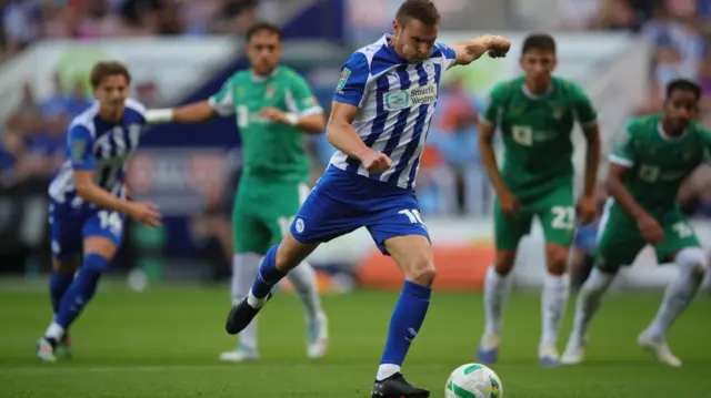 Paul Mullin scores for Wigan