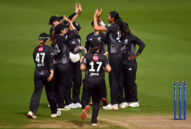 Mahika Gaur of Manchester Originals celebrates with teammates after taking the wicket of Tammy Beaumont