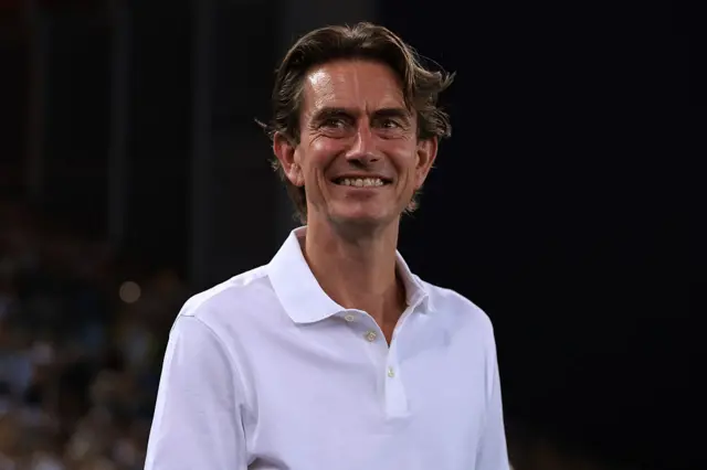 Frank beams on the sideline