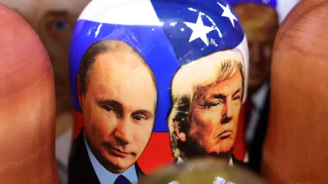 Traditional Russian wooden Matryoshka dolls depicting Russian President Vladimir Putin (L) and US President Donald Trump (R) on display for sale at a souvenir market in Moscow, Russia, 11 August 2025.