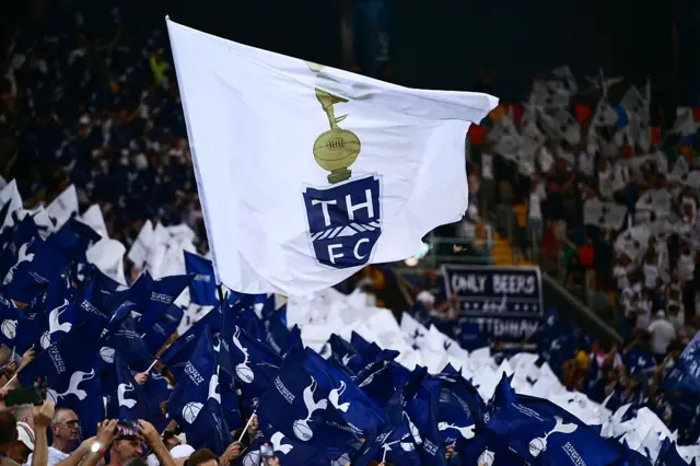 Spurs fans wave flags ahead of kick off