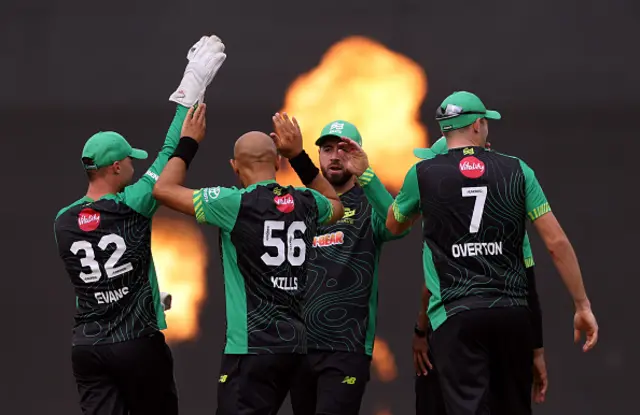Tymal Mills of Southern Brave celebrates with teammates after taking the wicket of Harry Brook